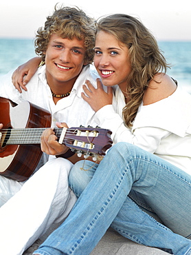 Young couple relaxing on beach