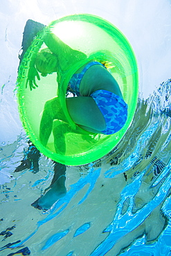 Underwater shot of child in inner tube, Florida, United States