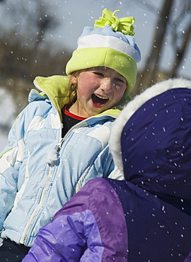 Children laughing in snow