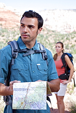 USA, Arizona, Sedona, Young couple hiking, man holding map