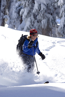 USA, California, Lake Tahoe, Mid adult woman skiing