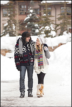 USA, Utah, Salt Lake City, couple walking in snowy village