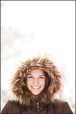 USA, Utah, Lehi, Portrait of young woman wearing fur hooded coat