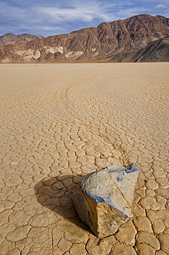 USA, California, Moving rock in desert 