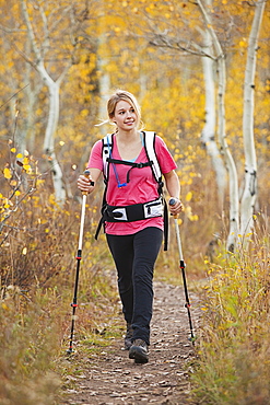 USA, Utah, young woman walking on trail