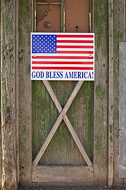 God bless American sign on barn door