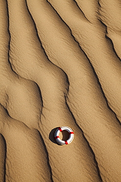 Lifebuoy in desert