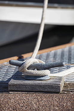 Rope tied to a docking cleat on a dock, Charleston Marina, OR