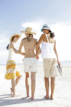 Friends walking in beach