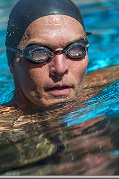 Portrait of swimmer wearing cap and goggles