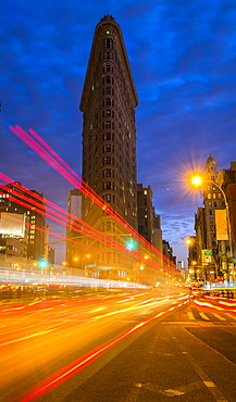 Traffic at night, Flatiron building in background, New York City, New York