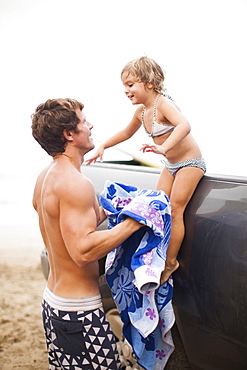 Baby girl (2-3) with father on beach, Kauai, Hawaii