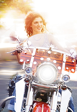 Young woman riding motorcycle