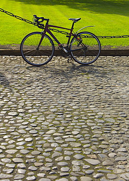 Bicycle on cobblestone path