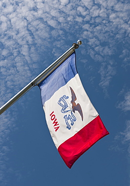 USA, Iowa State flag against sky