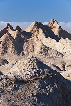 USA, South Dakota, Mountain against blue sky in Badlands National Park