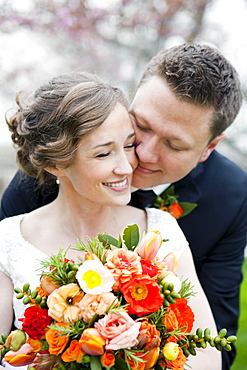 Newly wed couple kissing