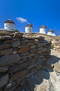 Greece, Cyclades Islands, Mykonos, Stone wall near old windmills