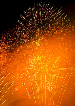 Fireworks explosion against night sky