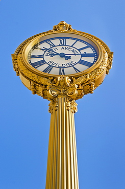 Antique clock against clear sky