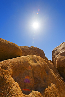 USA, California, Joshua Tree National Park, Desert rocks with solar flare, USA, California, Joshua Tree National Park