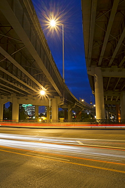 Low angle view of elevated highway overpass at night, Portland, Oregon