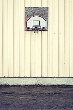 Basketball hoop on side of building in industrial area, Portland, Oregon