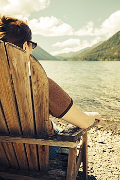 Mature woman relaxing and looking at Lake Crescent, Olympic National Park, Washington