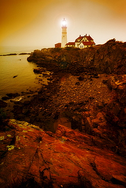 Remote coastline with lighthouse, Portland, Maine