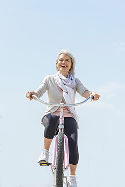 Senior woman riding bicycle
