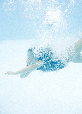 Girl diving underwater