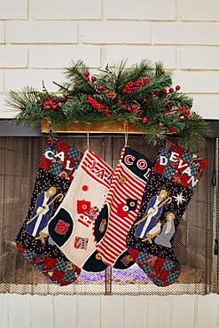 Christmas stockings hanging on fireplace