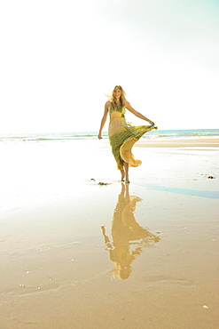 Woman walking on beach