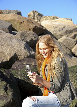 Woman dialing cell phone