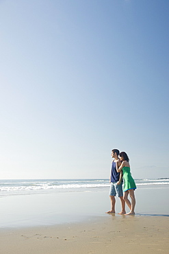 Couple standing on beach