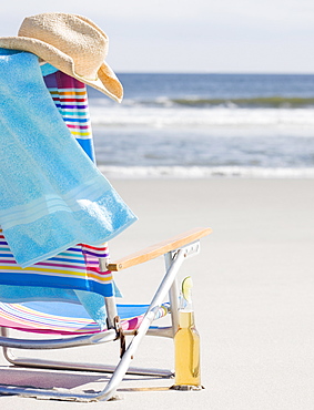 Beer next to beach chair