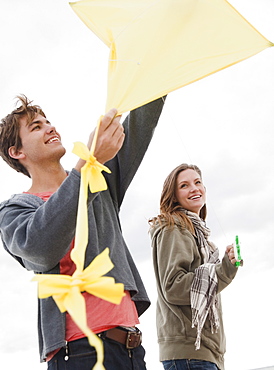 Couple flying kite