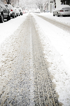 USA, New York State, Brooklyn, Williamsburg, tire track on snow covered street