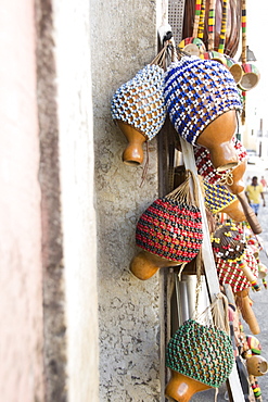 Brazil, Bahia, Salvador De Bahia, Rattles hanging against wall, close-up