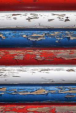 Red, white and blue peeling paint