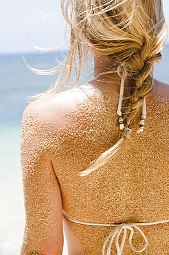 Woman's back with sticking sand, USA, Hawaii, Kauai, Princeville