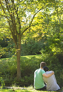 Couple sitting in park, Newtown, Connecticut