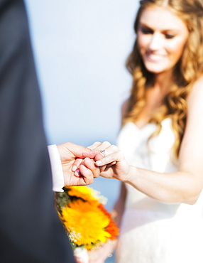 Bride and groom holding hands