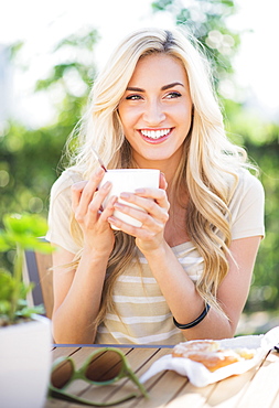 Portrait of teenage girl (16-17) drinking coffee 