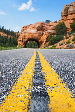 Road going under natural tunnel, USA, Utah, Bryce Canyon