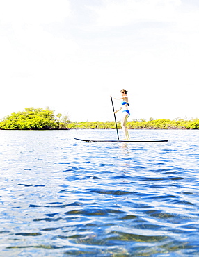 Woman on paddle board, Jupiter, Florida