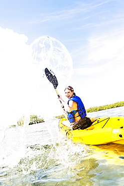 Woman kayaking, Jupiter, Florida