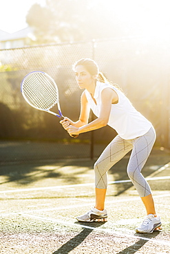 Portrait of young woman playing tennis in outdoor court, Jupiter, Florida