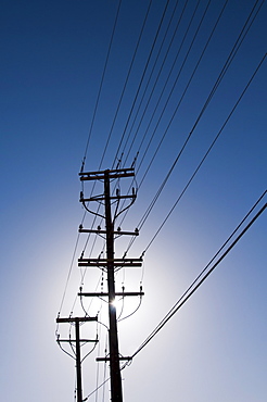Power line against blue sky