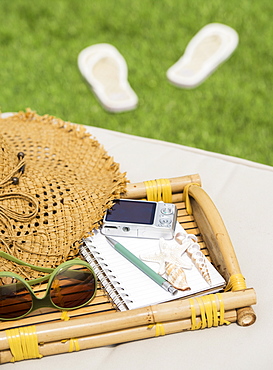 Bamboo tray with digital camera and notebook, USA, New Jersey, Jersey City